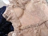 a close up of a bra top on a pile of clothes