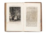 an open book with a picture of a man and a woman sitting on a bench