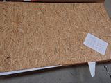 a piece of plywood that is laying on the floor
