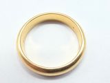 an image of a close up of a gold ring on a white surface