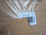 a cardboard box with a pattern on it and a pair of scissors next to it