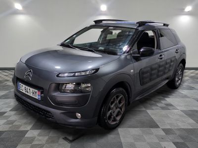 the grey citrole is parked on a checkered tile floor