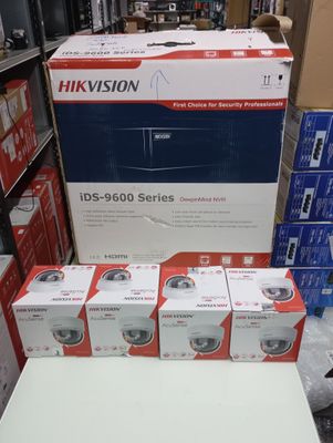 several boxes of cameras are stacked on top of each other in a store