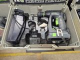 a tool box with tools inside of it on the floor