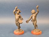 paire de figurines anciennes en bronze représentant des chérubins tenant un bol