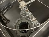 a sink with a drain in the middle of it