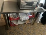 a toaster oven sitting on a table in a kitchen
