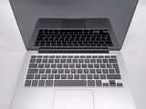 a laptop computer sitting on top of a white table
