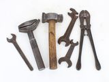 five different types of tools on a white surface