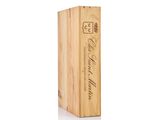 a wooden box with a wine bottle inside of it on a white surface