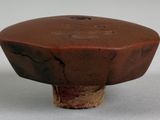 a small brown object that is sitting on a table
