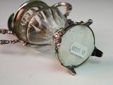 a glass jar with a label on it sitting on a table