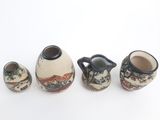 three vases that are sitting next to each other on a table