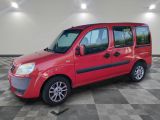 a picture of a red van parked in a garage