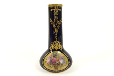 a black and gold vase with a picture on it