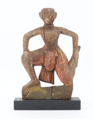 an image of a statue of a woman sitting on top of a rock