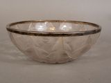 a glass bowl that is sitting on a table