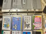 a suitcase full of cards and other items sitting on a table