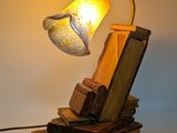 a lamp that is sitting on top of a pile of books