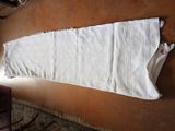 a white towel hanging on a wall next to a chair