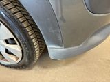 a close up of a car ' s tire on the ground