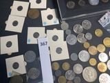 a lot of coins on a table with a price tag on it
