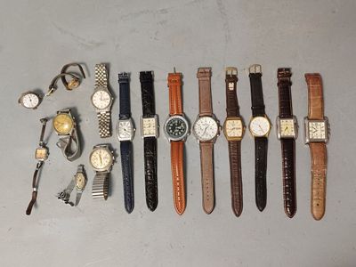 a lot of watches and cuff watches on the table