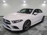 the mercedes cla is parked on a checkered tile floor