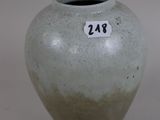 a gray vase with a number on it on a white background