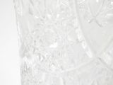 a clear glass vase with a pattern on it