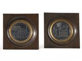 pair of bronze and wood plaques depicting a church and a church