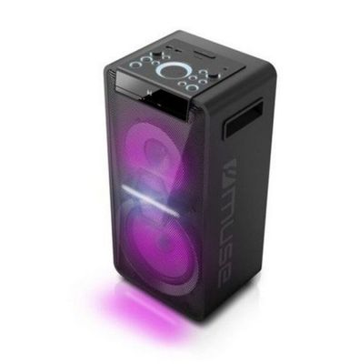 un gros plan d'un haut-parleur sur lequel brille une lumière violette