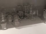 many empty glasses on the counter in the kitchen