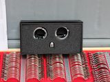 a display case with a bunch of coils on it