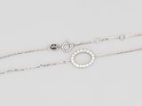 a pair of silver bracelets with diamonds on a white background