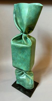 sculpture of a green vase on a black base on a white background