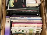 a cardboard box full of books on the floor