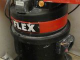 a black and red machine that is sitting on the floor