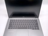 an open laptop computer sitting on top of a white table