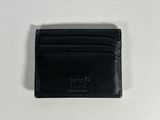 black leather card case on a white surface with a white background