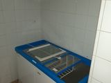 a small kitchen with a sink and a washing machine