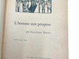 an open book with a picture of a group of people on it