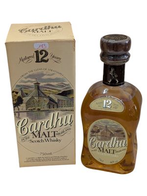 an image of a bottle of whisky sitting next to a box