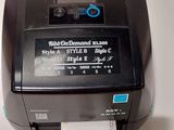 a label printer sitting on top of a table