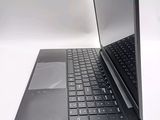 a laptop computer sitting on top of a white table