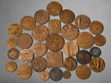 a lot of coins that are laying on the table