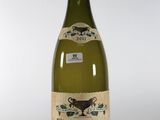 a bottle of wine that is sitting on a table