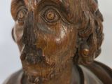 carved wooden bust of a man with a beard and mustache
