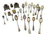 a lot of silver spoons and spoon spoons on the table