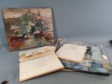 un livre ouvert posé sur une table, à côté d'un tableau